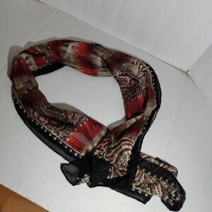 Marked Bill Blass: Black and red design scarf. Measures approx. 10.5" X 55".